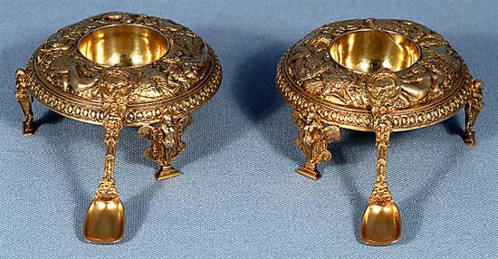 A good pair of Victorian cast silver gilt salt cellars and spoons, by Jane Brownett? height 40mm, weight 7.3 oz/230grms.